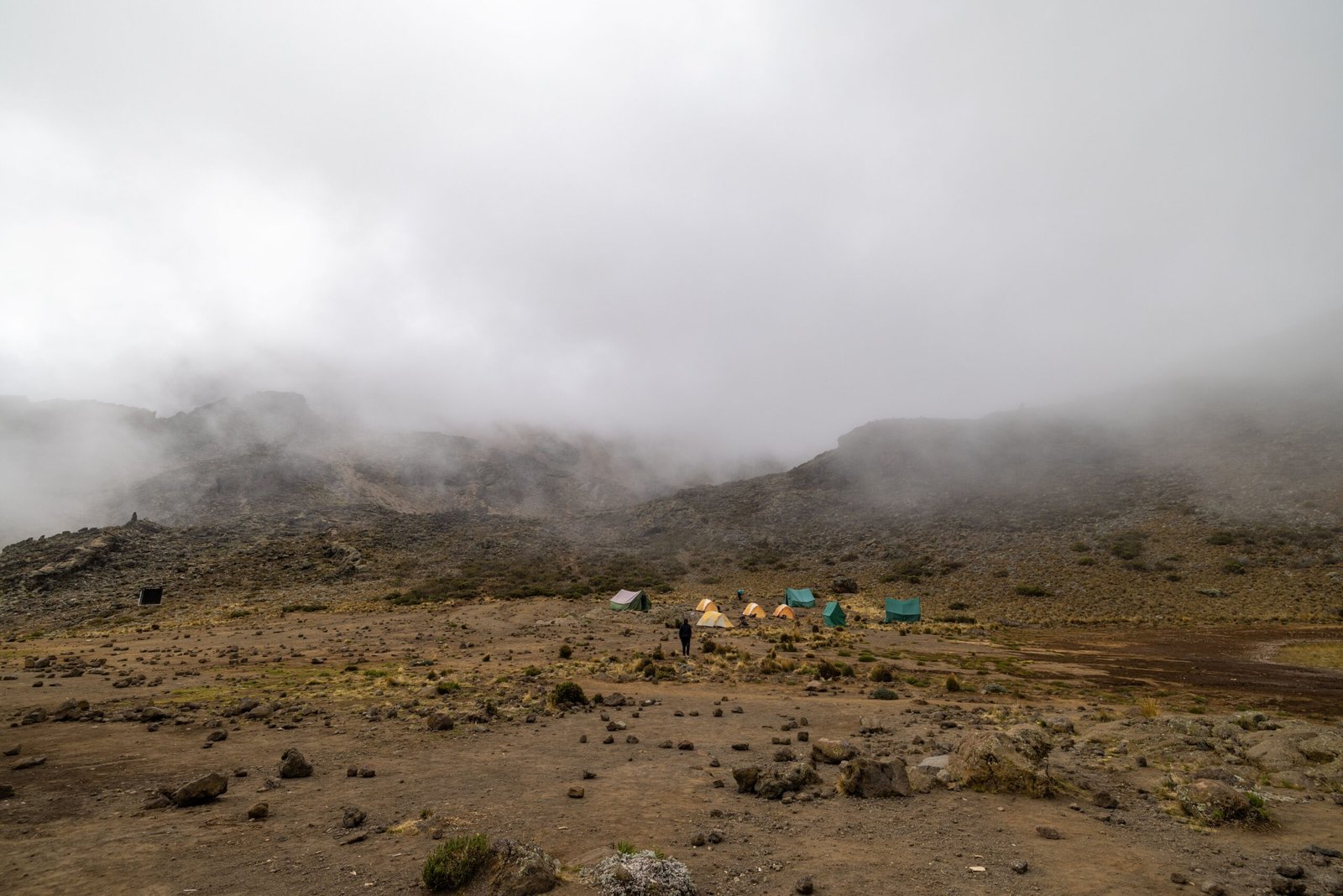 Camping amidst foggy landscapes on Mount Kilimanjaro's Tanga Region, Tanzania.
